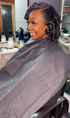 Stylist at work in M & Co. Hair Salon, Roxbury Boston